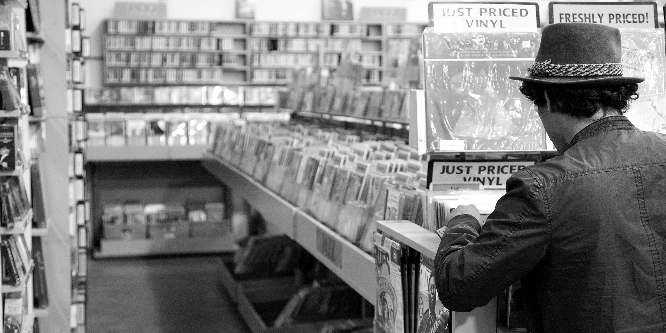 Man Looking Through Records at Record Store